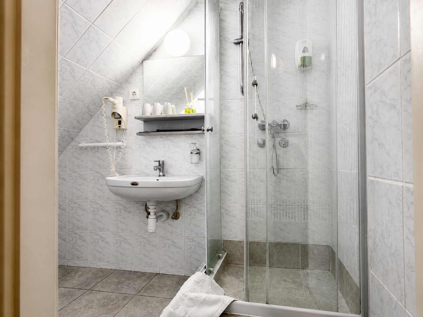 Refreshed private bathroom with a modern shower cabin
