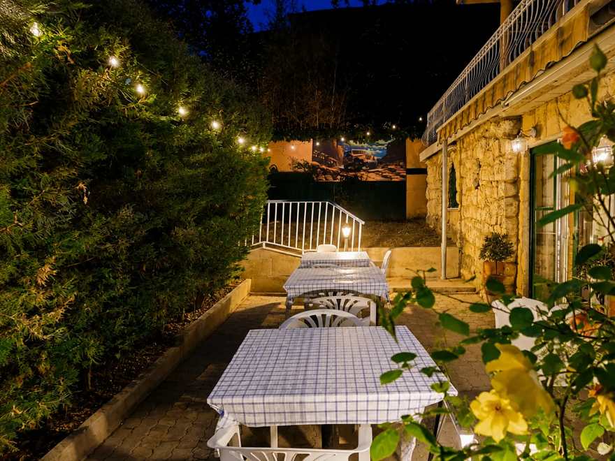Landscaped inner garden with seating at Villa Kristal Hotel Budapest